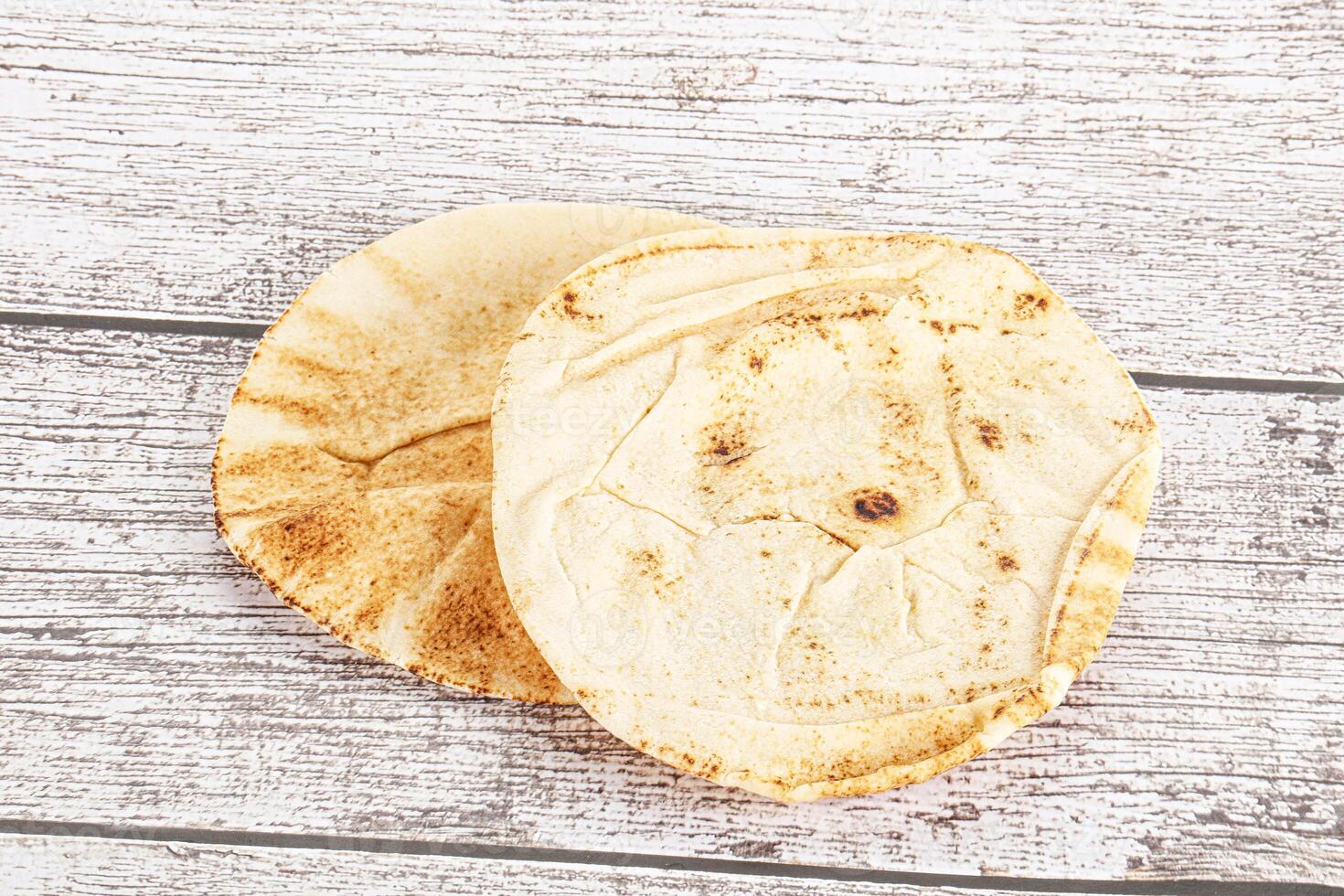 Traditional eastern round pita bread photo