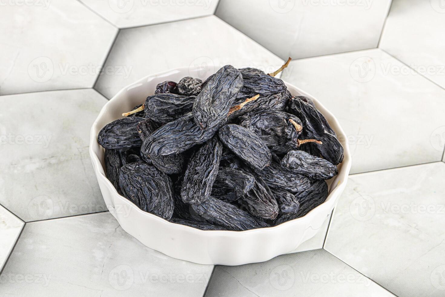 Blue raisin - dry grape berries photo