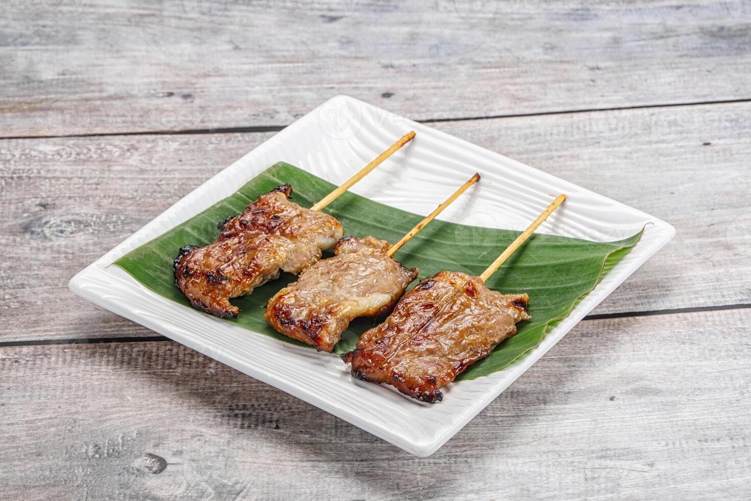 Thai cuisine - grilled pork skewer photo