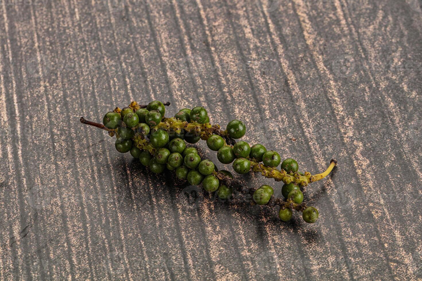Green pepper corn heap isolated photo