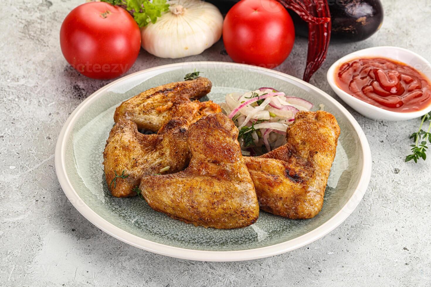 Grilled chicken wings with sauce photo