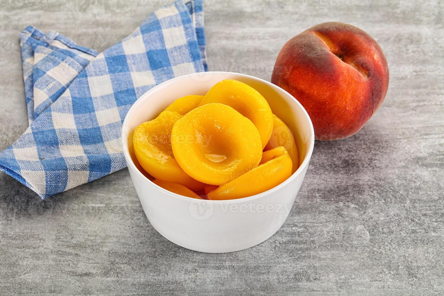 Ripe sweet and juicy canned peach photo