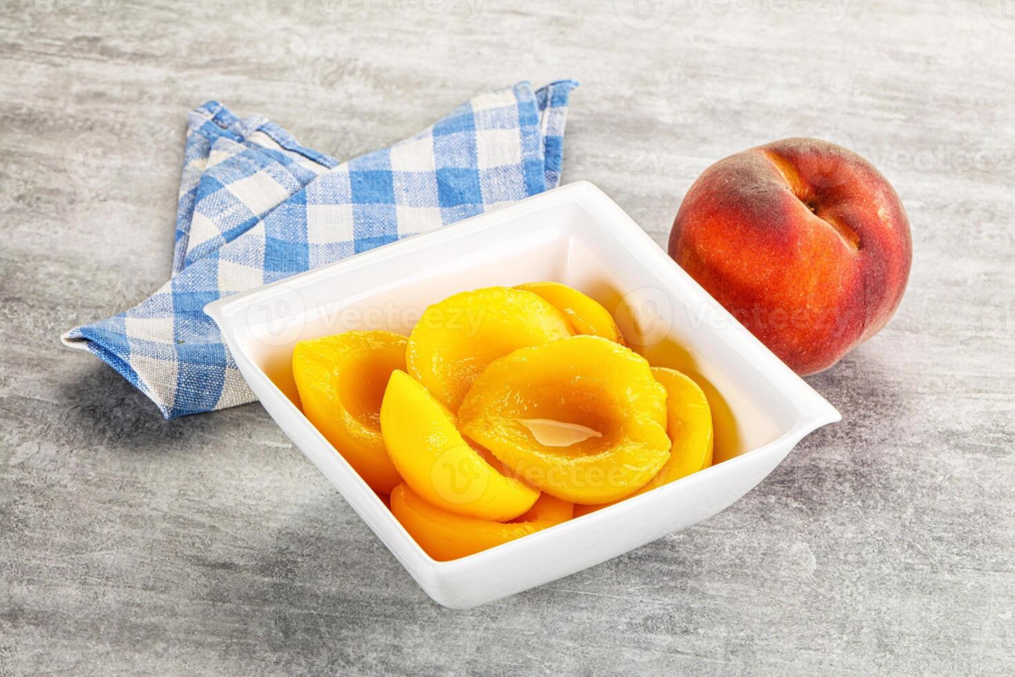Ripe sweet and juicy canned peach photo