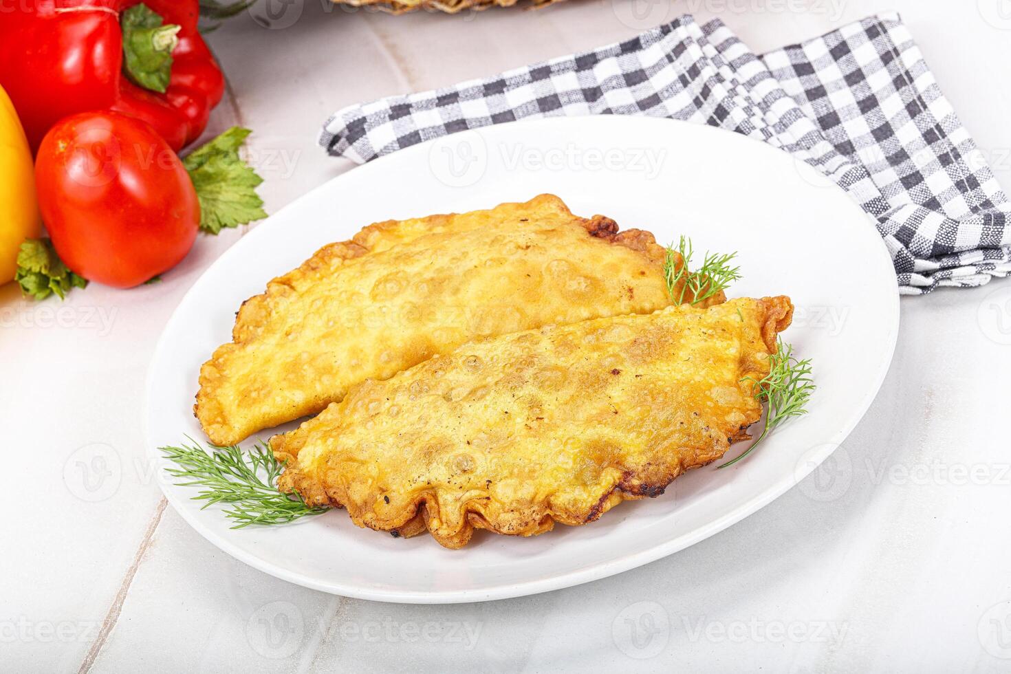 Homemade fried cheburek with meat photo