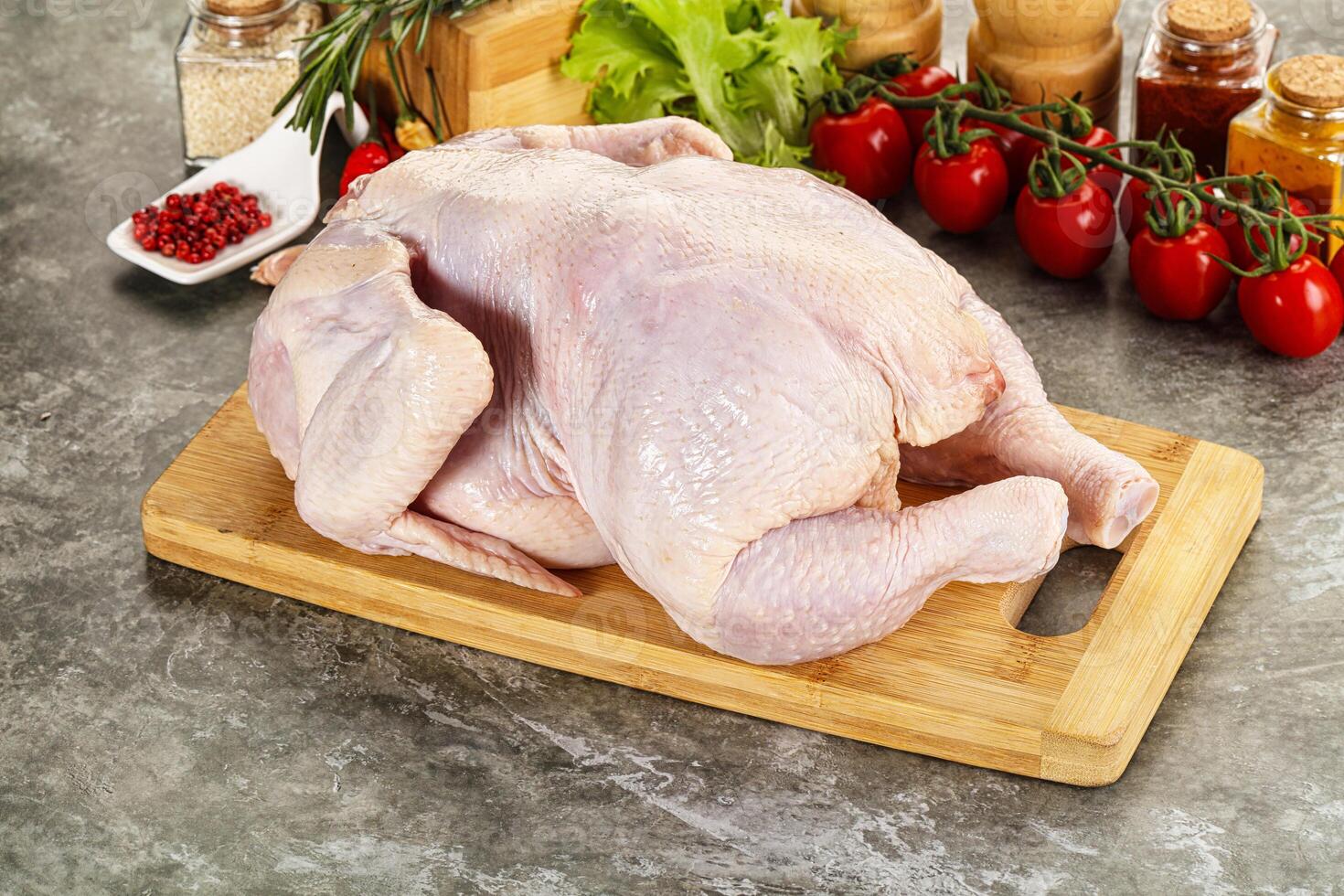 Raw whole chicken for cooking photo