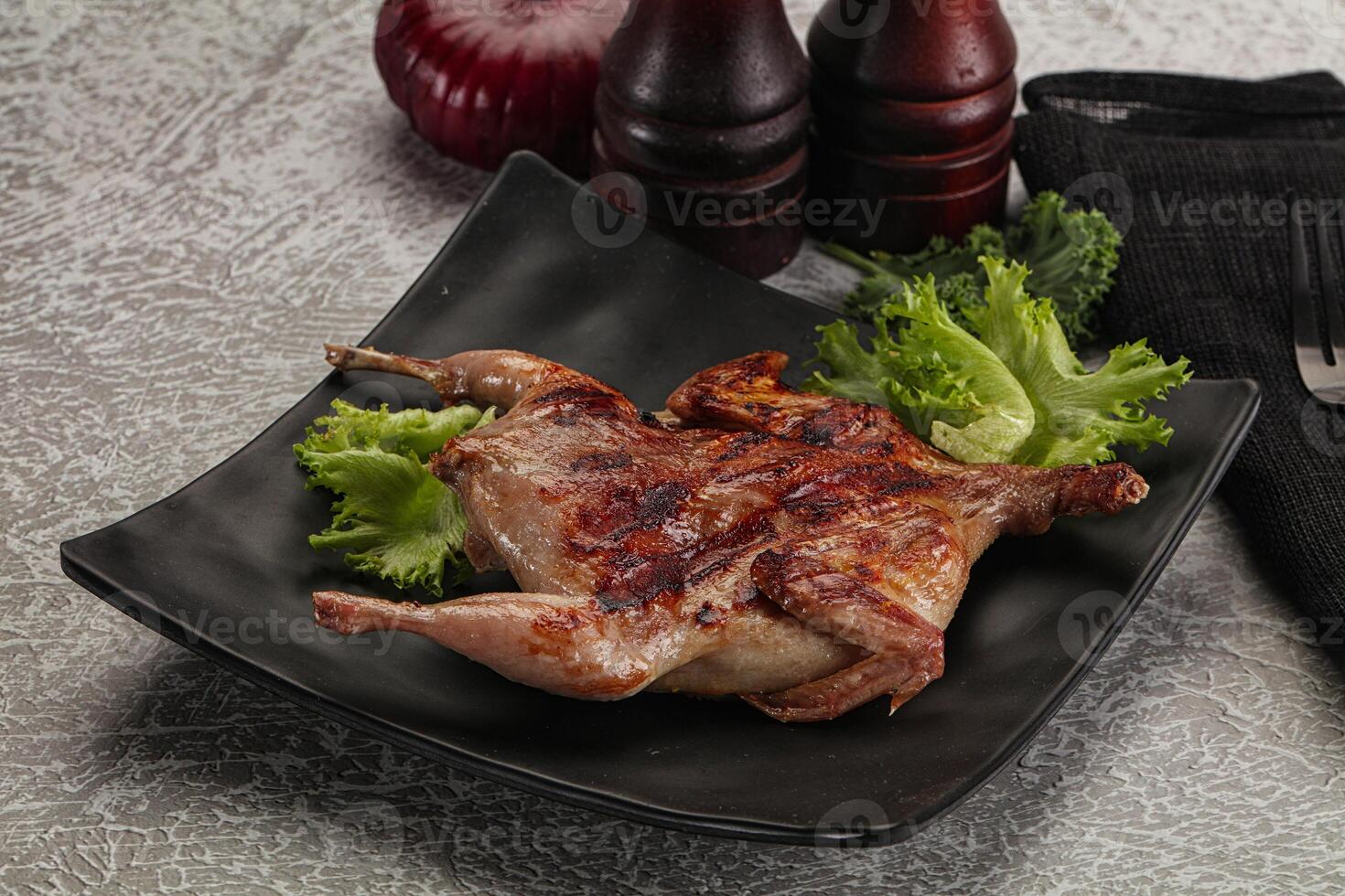 Grilled quail in the plate photo