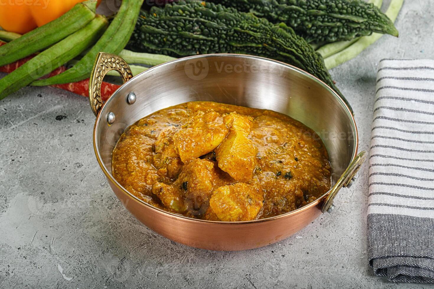 Spicy chicken masala in the bowl photo