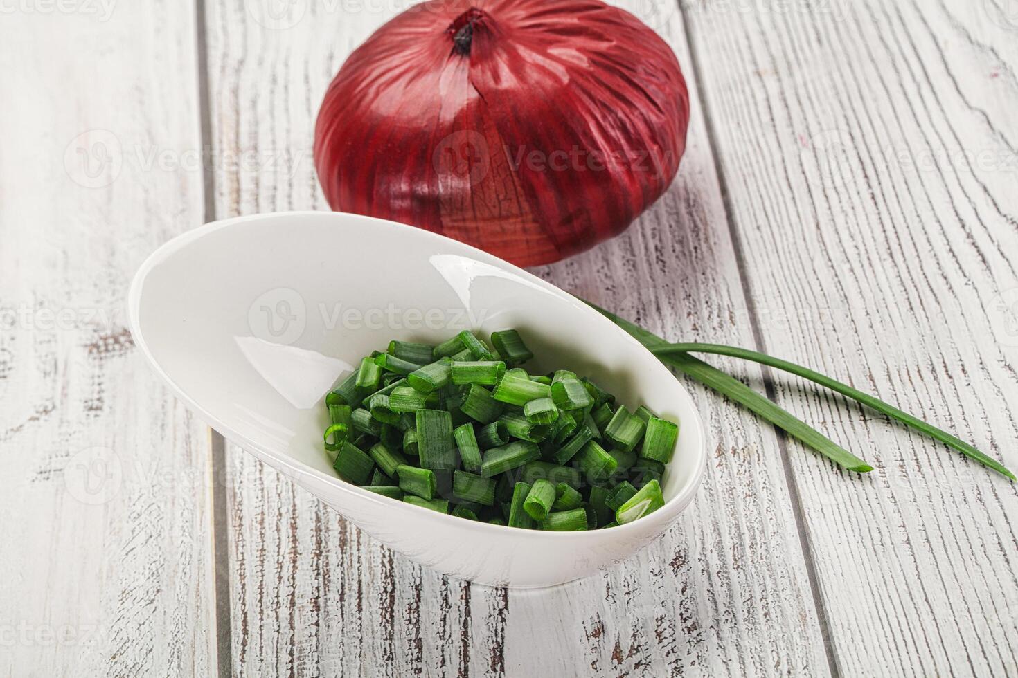 Diced green onion in the bowl photo
