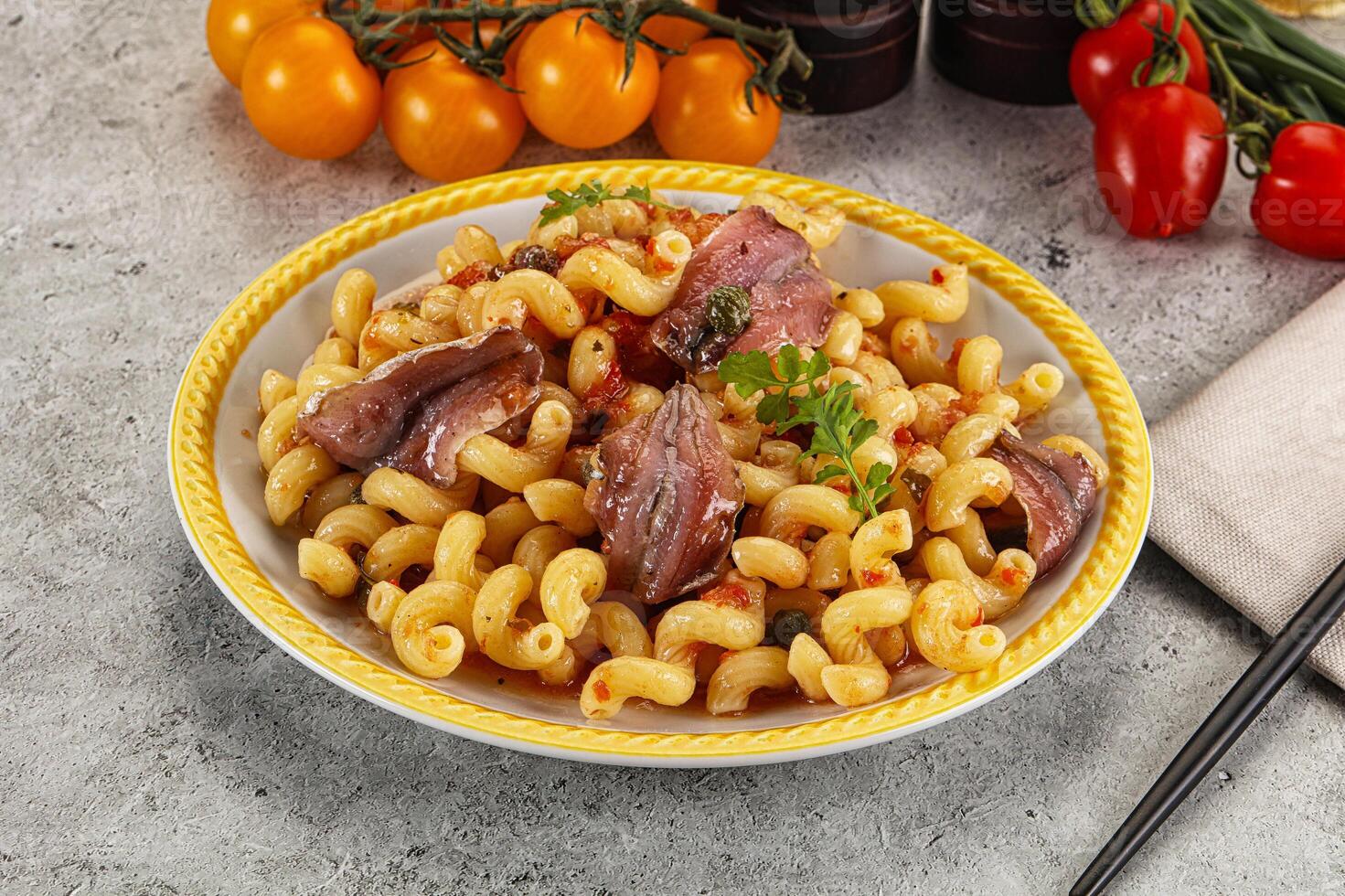 Italian pasta cellentani with anchovy photo