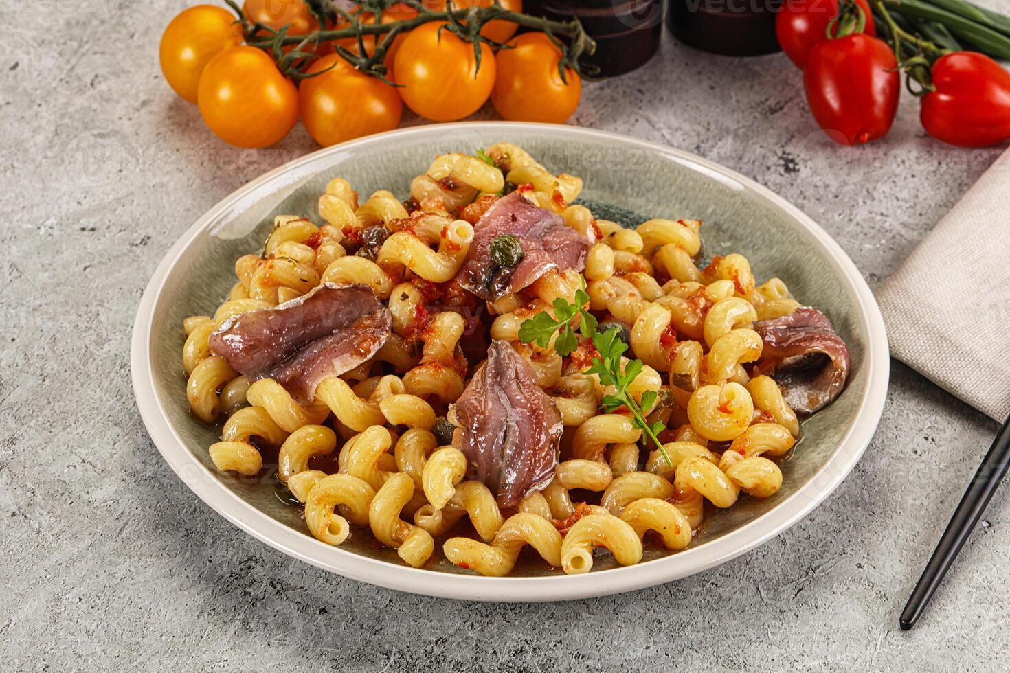 Italian pasta cellentani with anchovy photo