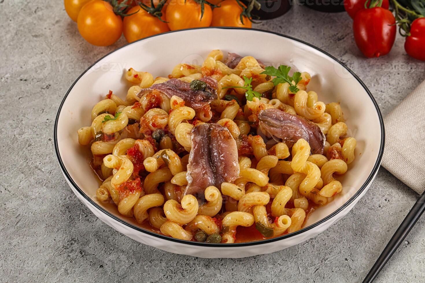 Italian pasta cellentani with anchovy photo