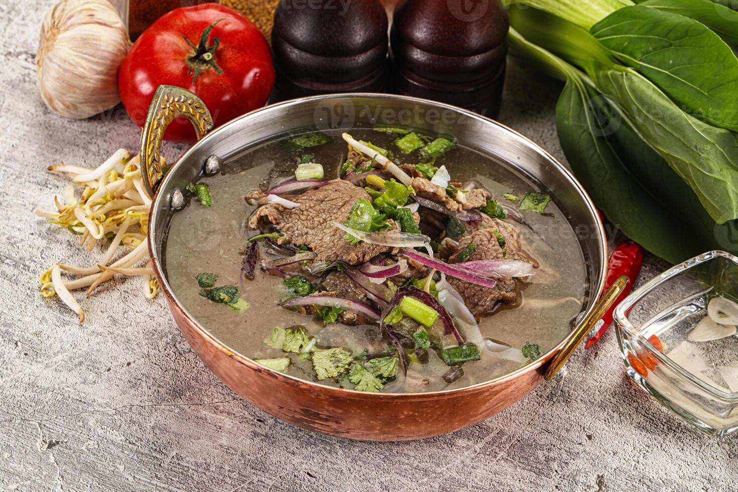 Vietnamese cuisine - Pho Bo soup with beef photo
