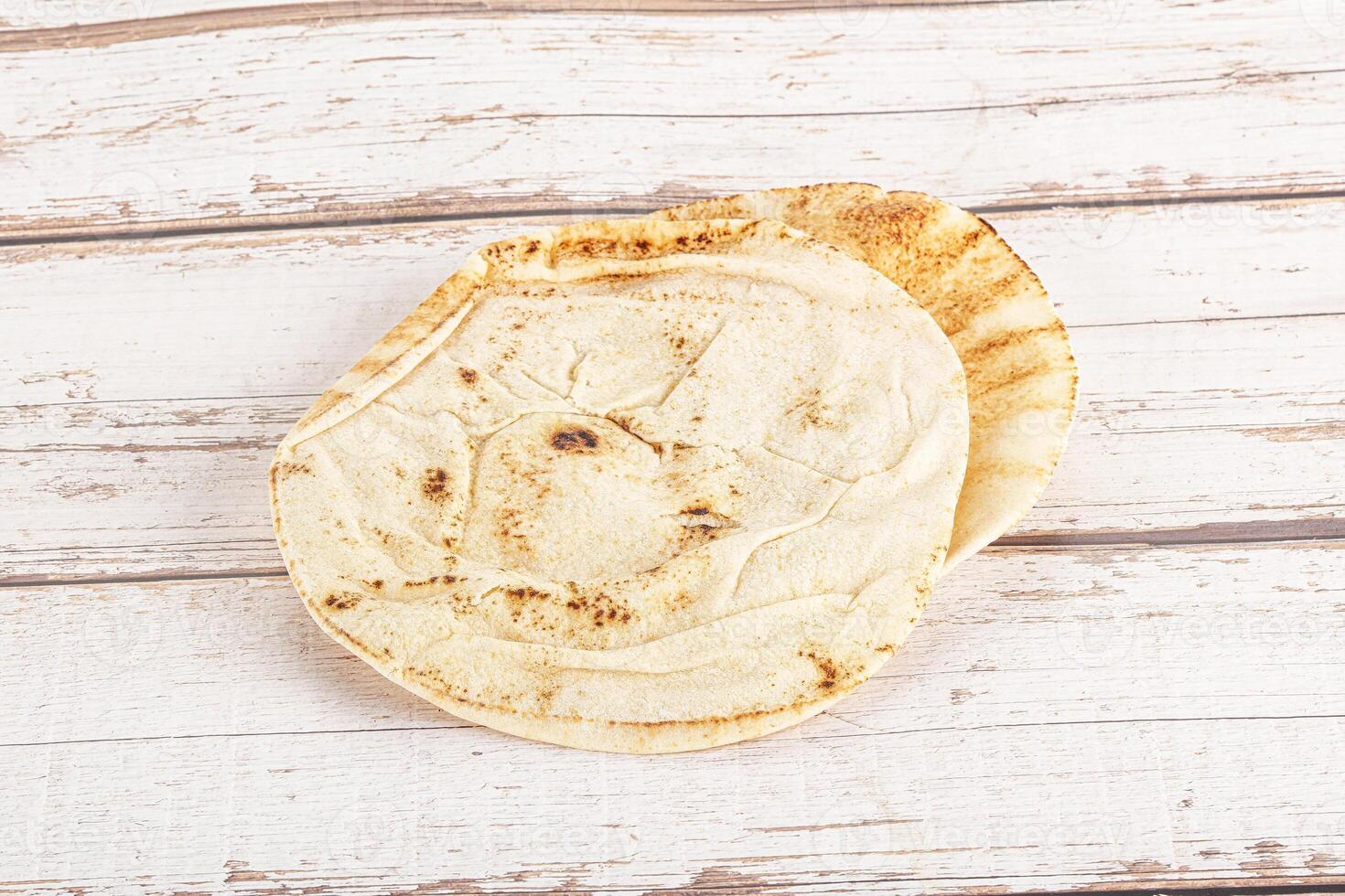 Traditional eastern round pita bread photo