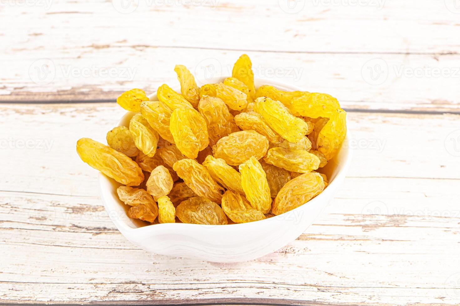 Yellow raisin - dry grape berries photo