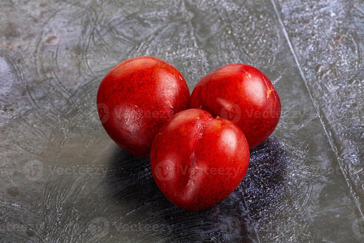 Ripe sweet juicy red plum photo