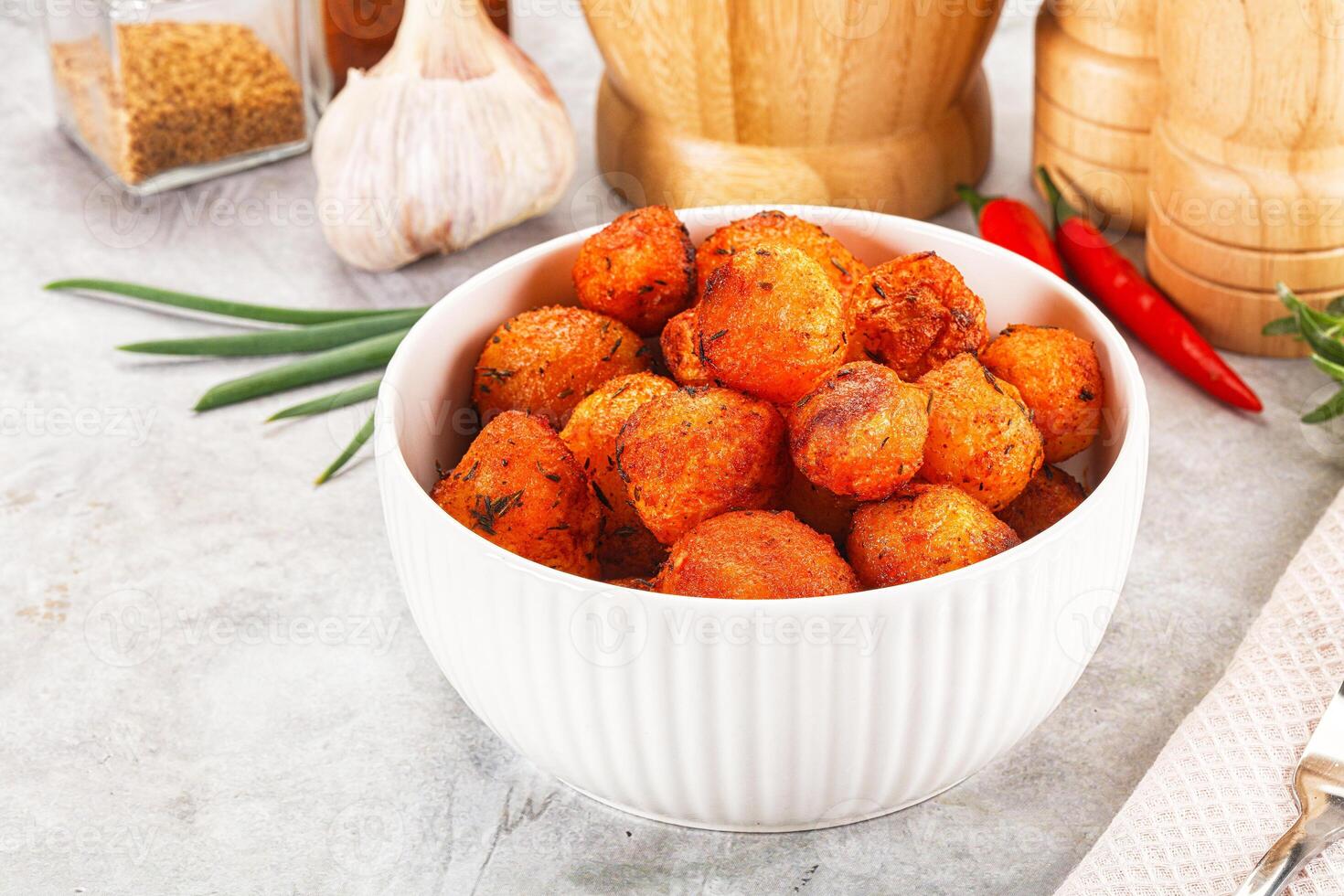 Baked young potato with paprika photo