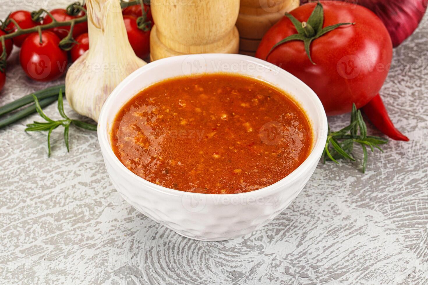 Hot tomato soup with diced chicken photo