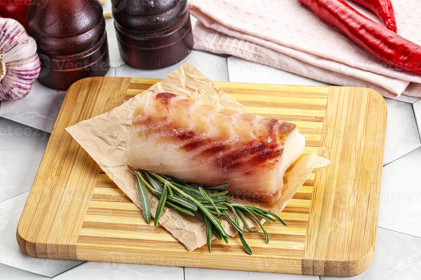 Raw cod fish steak for cooking photo