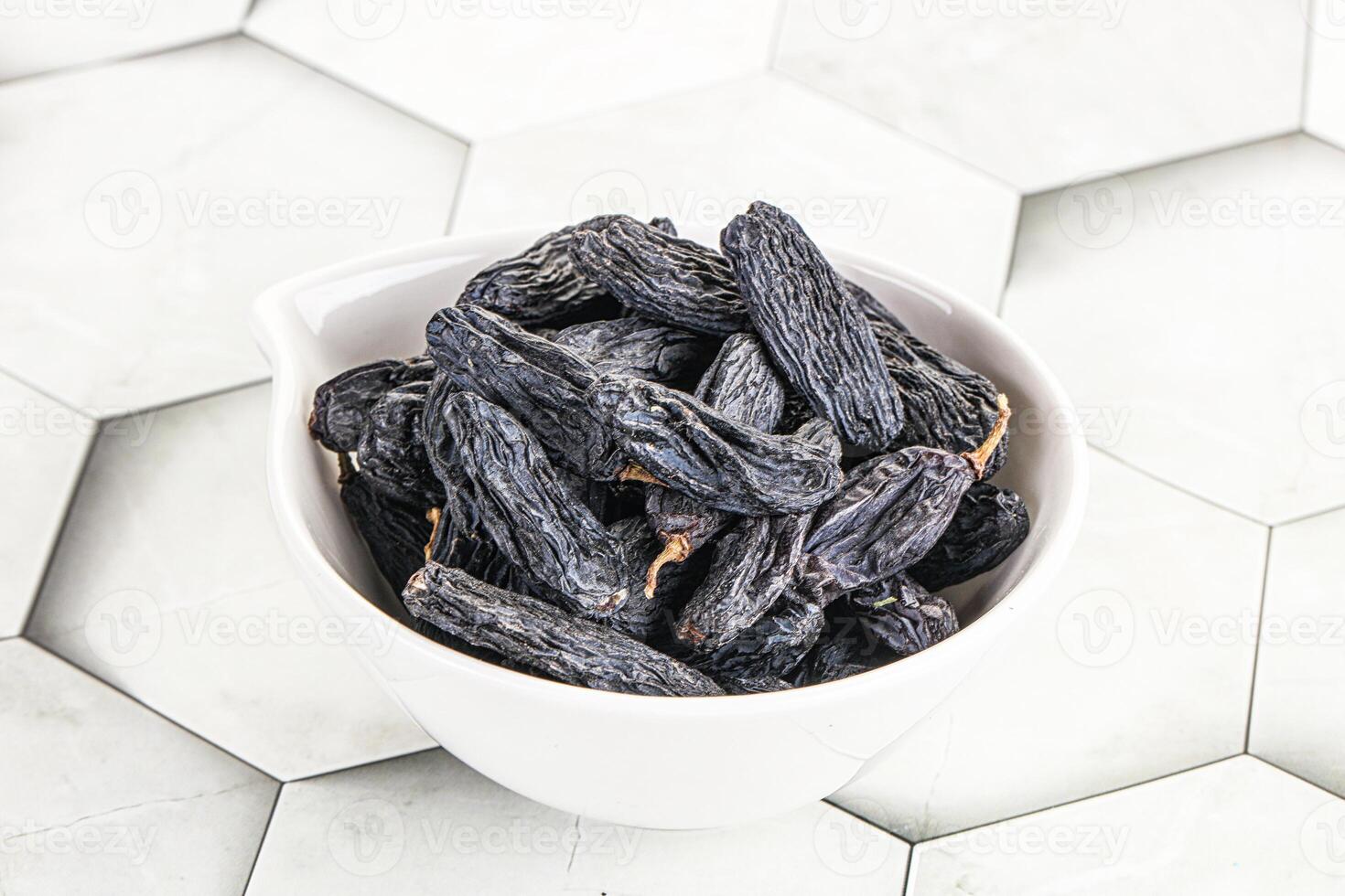 Blue raisin - dry grape berries photo