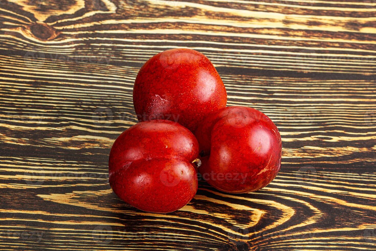 Ripe sweet juicy red plum photo