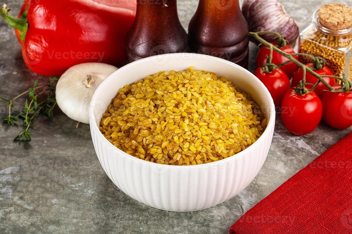 Dry wheat bulgur cereal heap photo