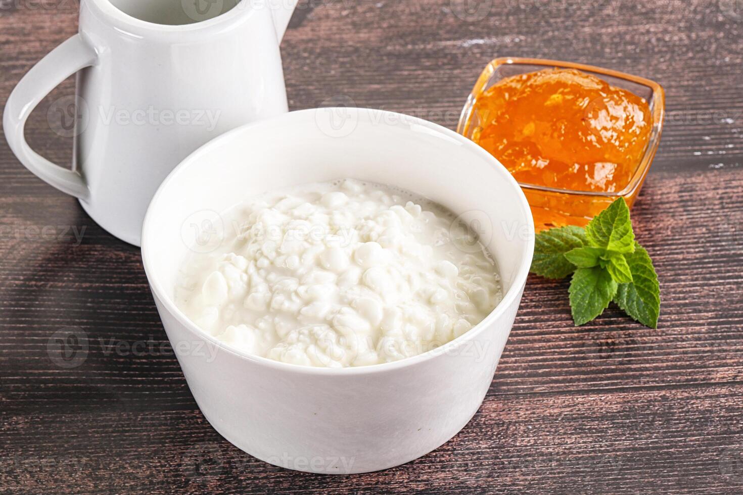 Grain curd with cream and jam photo
