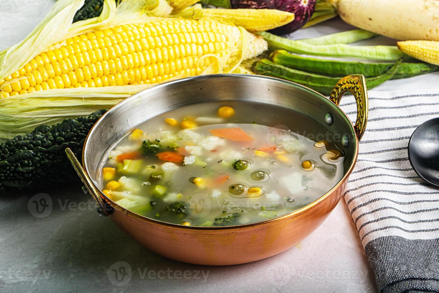 Soup with corn and broccoli photo