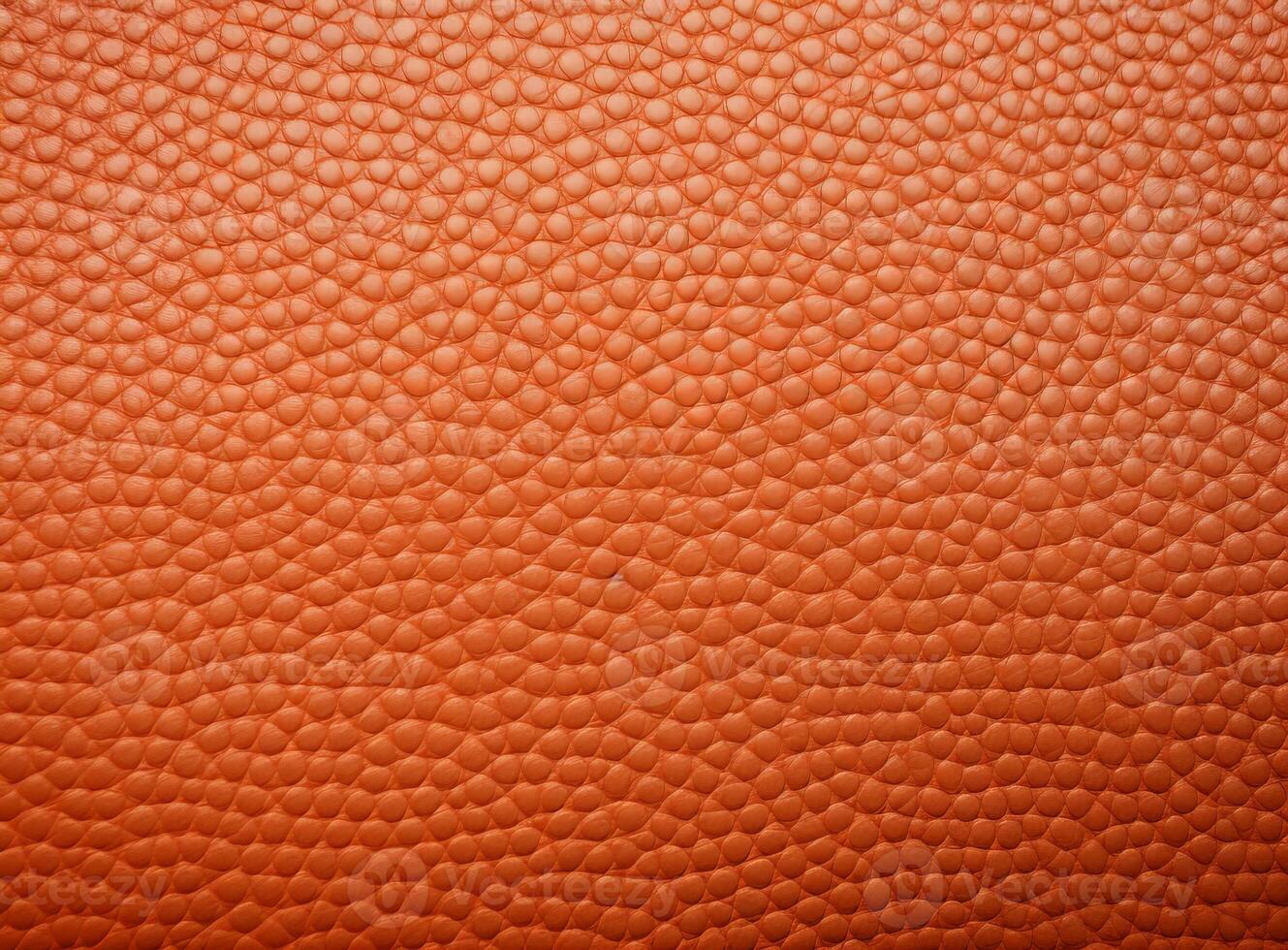 Close-up leather with a smooth, slightly uneven texture. photo