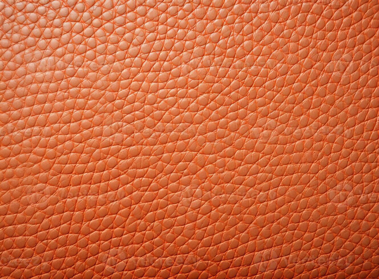 Close-up leather with a smooth, slightly uneven texture. photo