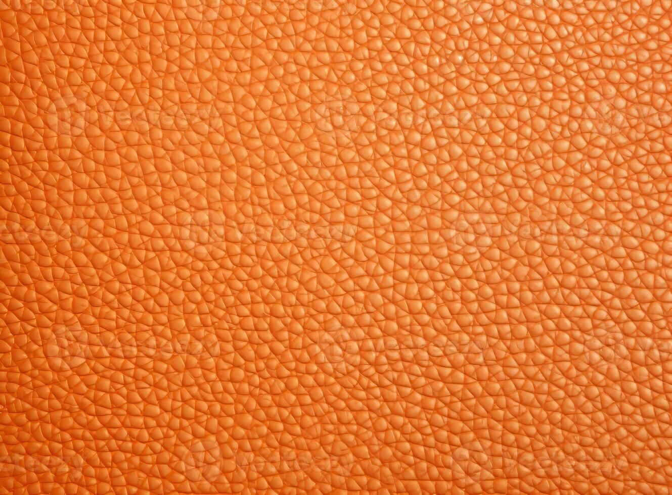 Close-up leather with a smooth, slightly uneven texture. photo