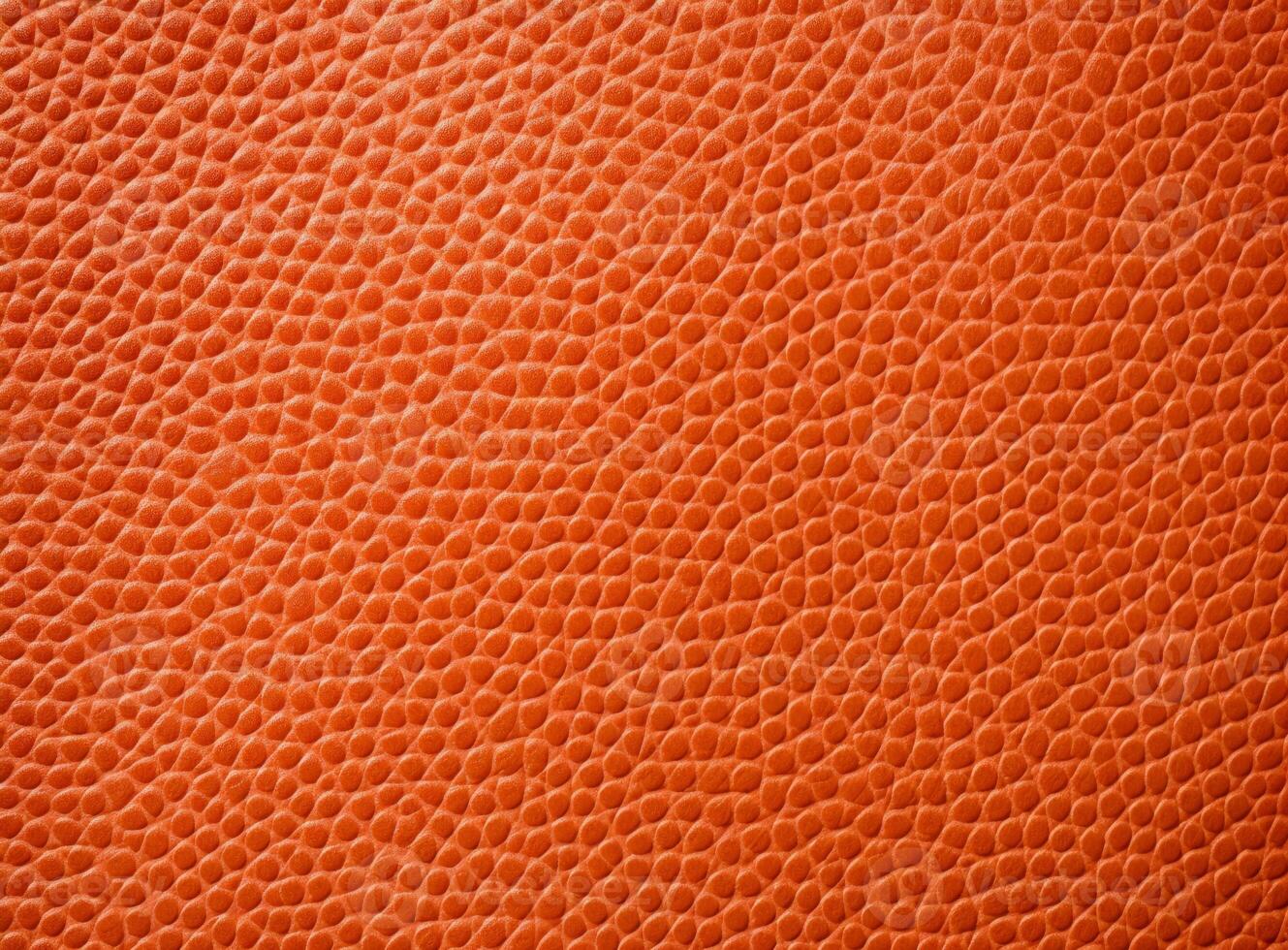 Close-up leather with a smooth, slightly uneven texture. photo