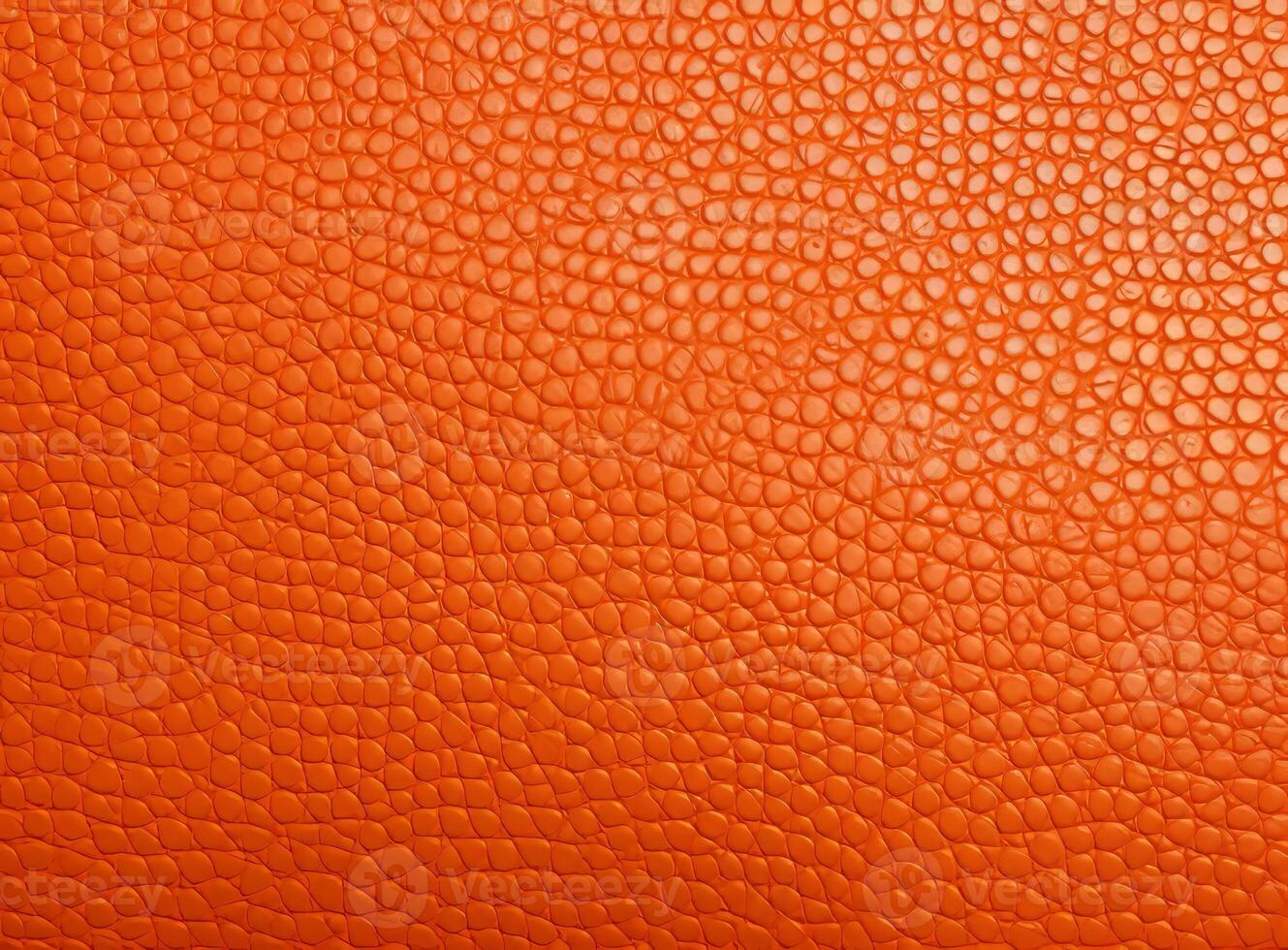Close-up leather with a smooth, slightly uneven texture. photo