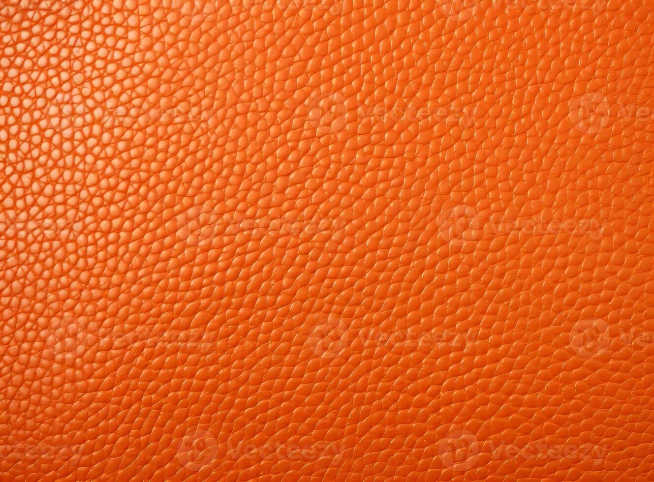 Close-up leather with a smooth, slightly uneven texture. photo