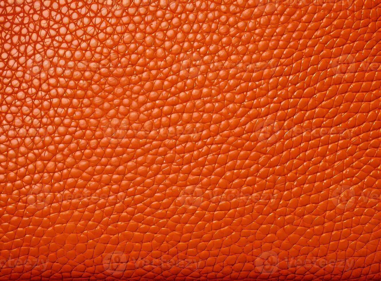 Close-up leather with a smooth, slightly uneven texture. photo