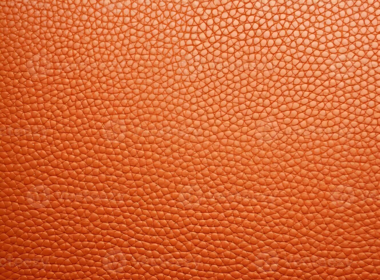 Close-up leather with a smooth, slightly uneven texture. photo