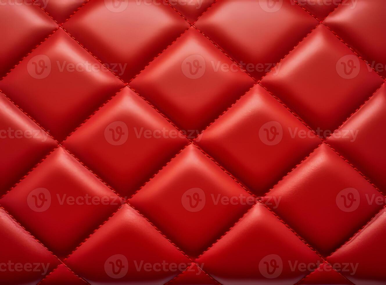 Luxurious red leather material with a classic diamond stitching pattern. photo
