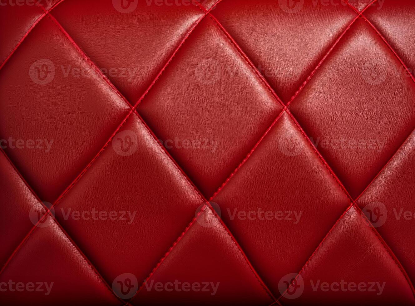Luxurious red leather material with a classic diamond stitching pattern. photo