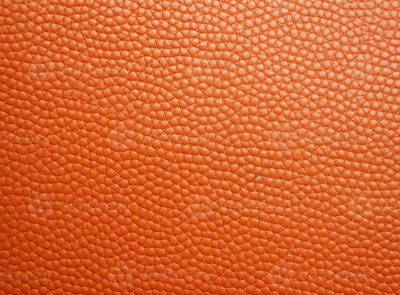 Close-up leather with a smooth, slightly uneven texture. photo