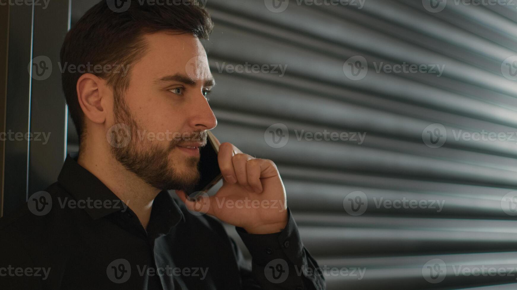 Caucasian businessman talk mobile phone indoors business entrepreneur salesman chatting with colleague remote conversation use smartphone man guy speaking cellphone talking smartphone calling remote photo