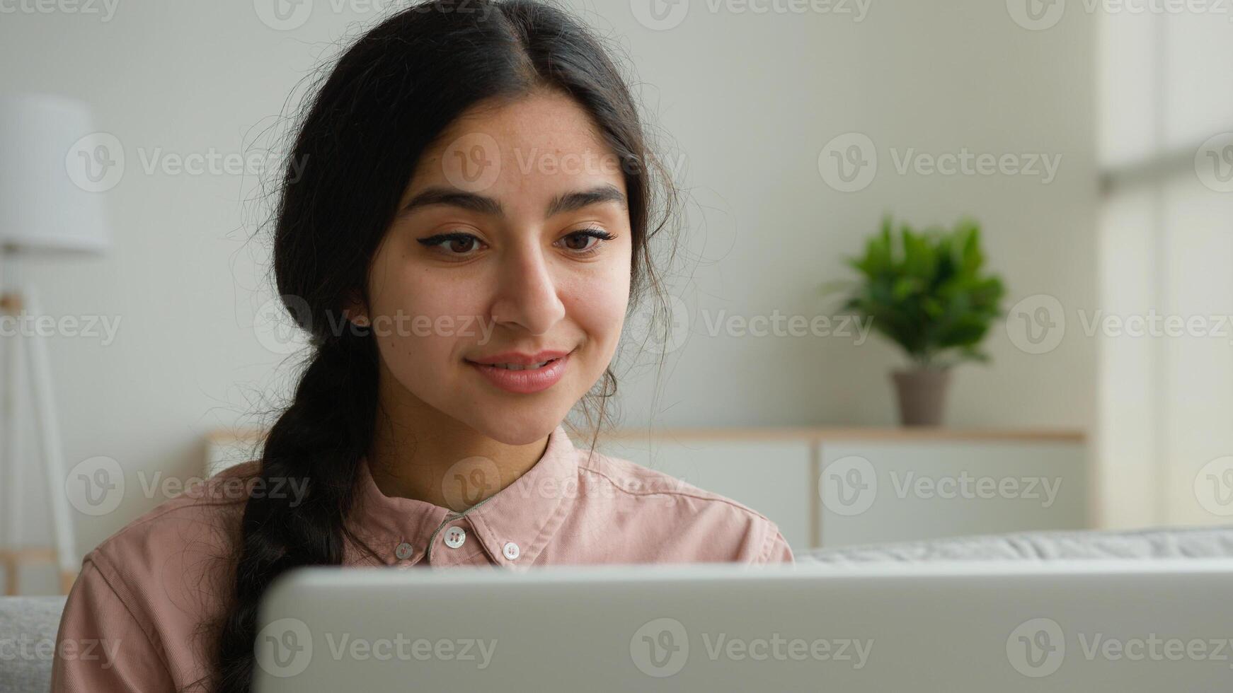 Happy Arabian woman student at home working with computer remote education e-learning write business project online studying with laptop Indian businesswoman girl make internet order surfing website photo