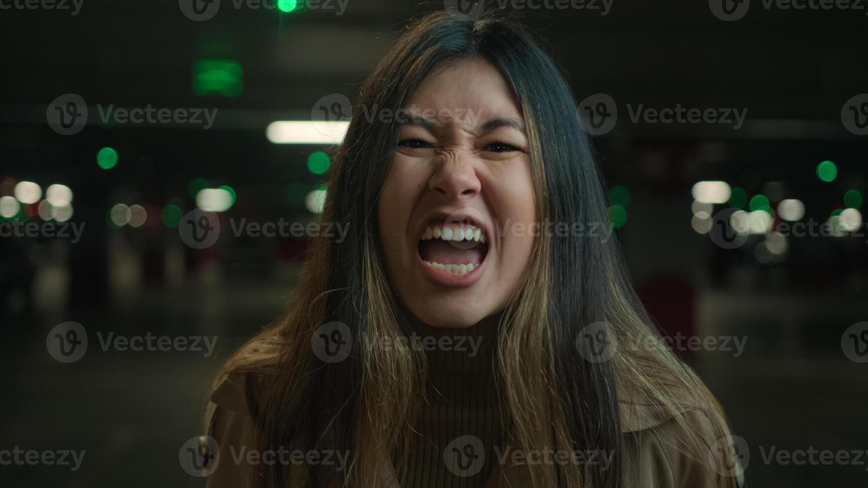 Mad angry crazy Asian korean chinese japanese girl shout in car parking furious woman annoyed businesswoman client speak loud screaming talk solve conflict feel anger rage talking scream webcam view photo