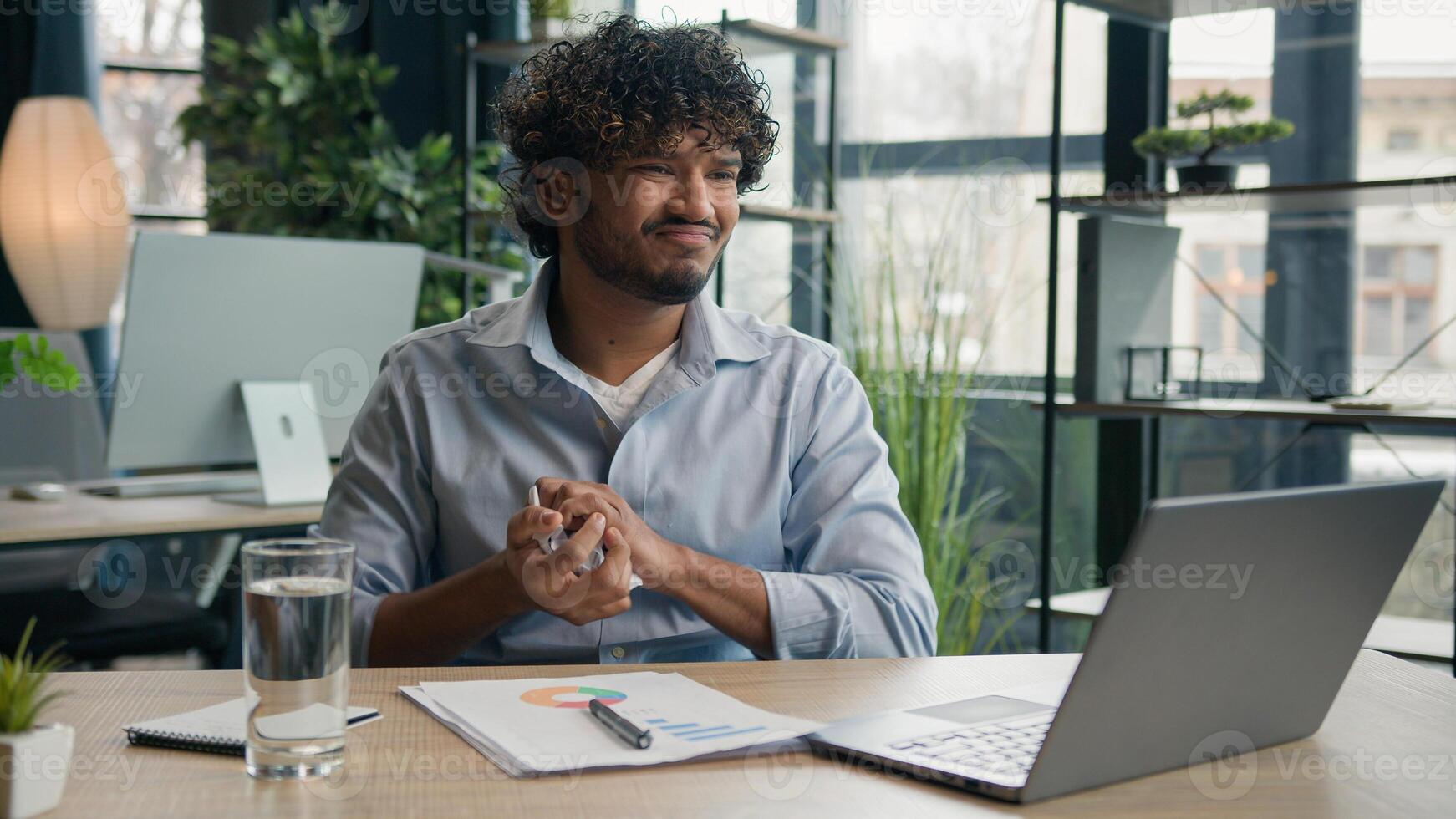 Arabian Hispanic businessman anxious desperate office worker annoyed man work financial data analysis write strategy business audit graphs crumpling sheet of paper throw away burnout failure mistake photo