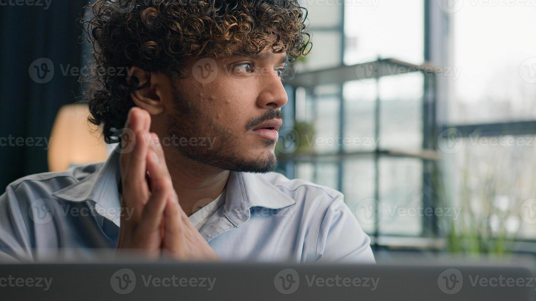 Pensive thoughtful Indian Arabian man male business person puzzled ethnic businessman employer think ideas deep thoughts search answer difficult question solve issue doubt analysis thinking at office photo