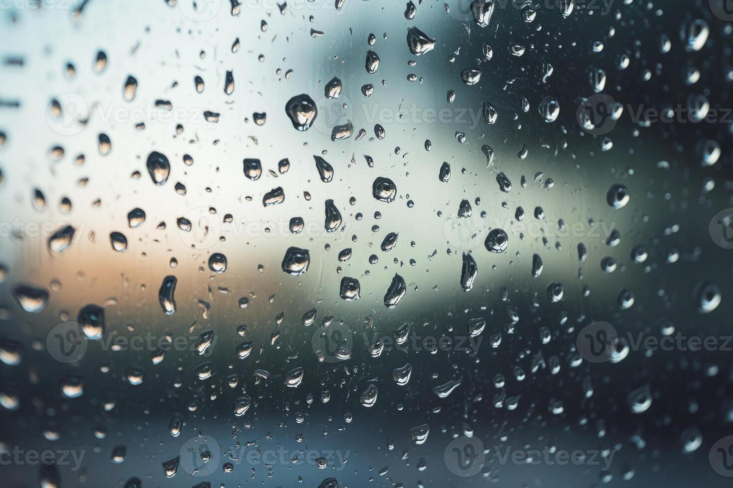 Shiny raindrops splashes falling cascading down wet glossy foggy glass window car outdoor during rainy stormy day backdrop. Close-up processes motion of beautiful clear fresh water photo