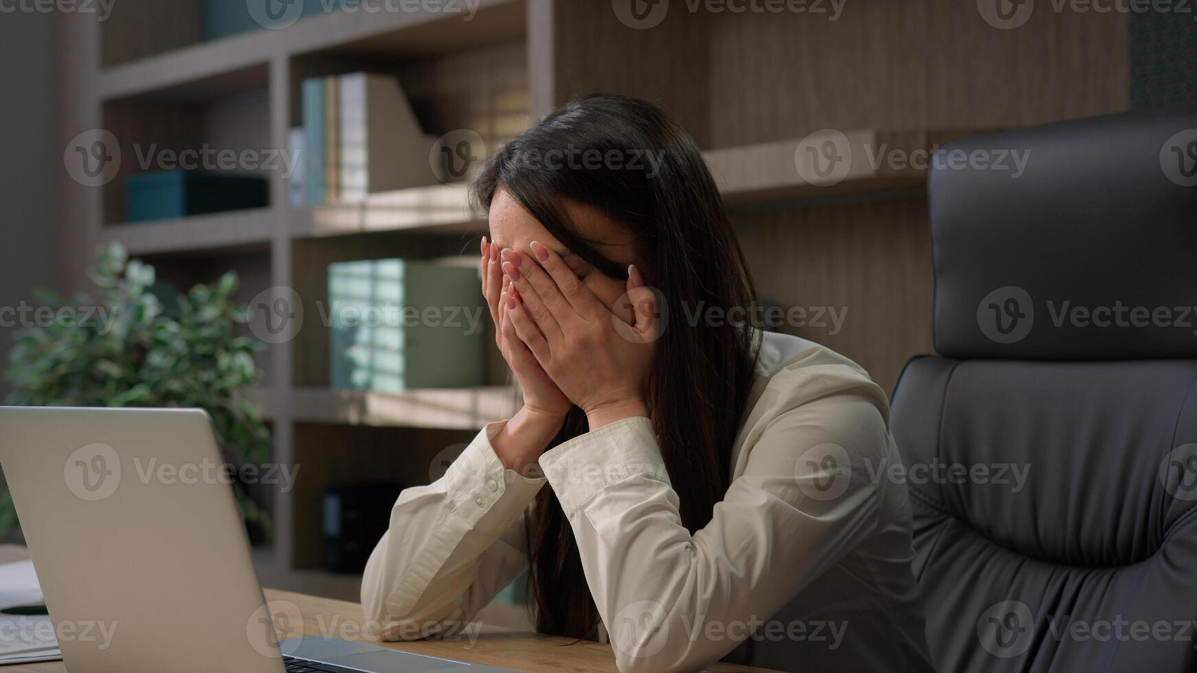 Caucasian businesswoman in office computer error crash business woman girl female worker sit at desk work on laptop upset problem device system bug data loss battery low issue unsaved lost information photo