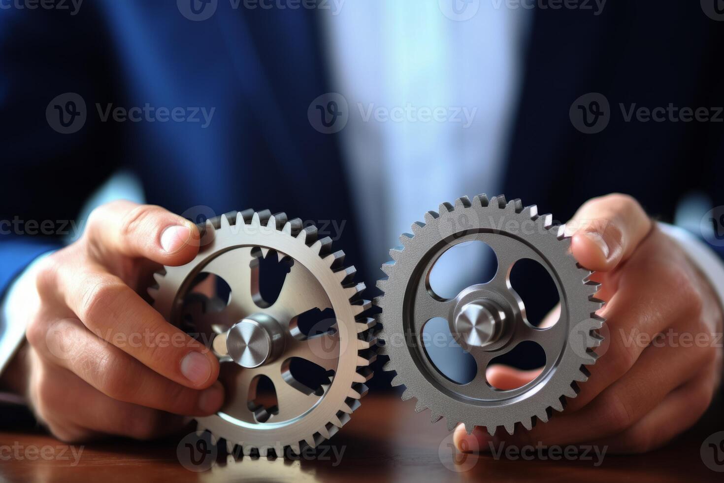 Man holding gear in hands. Teamwork metallic silver equipment industrial progress engineering machine mechanical cog wheel technology steel power transmission motion circle construction photo