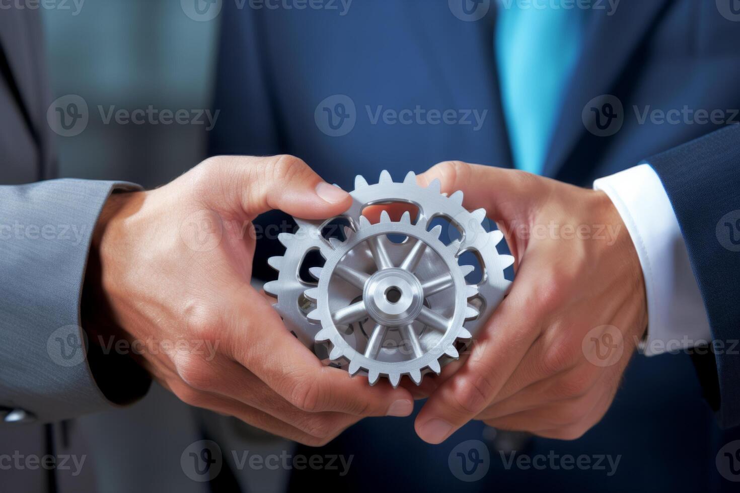 Man holding gear in hands. Teamwork metallic silver equipment industrial progress engineering machine mechanical cog wheel technology steel power transmission motion circle construction photo