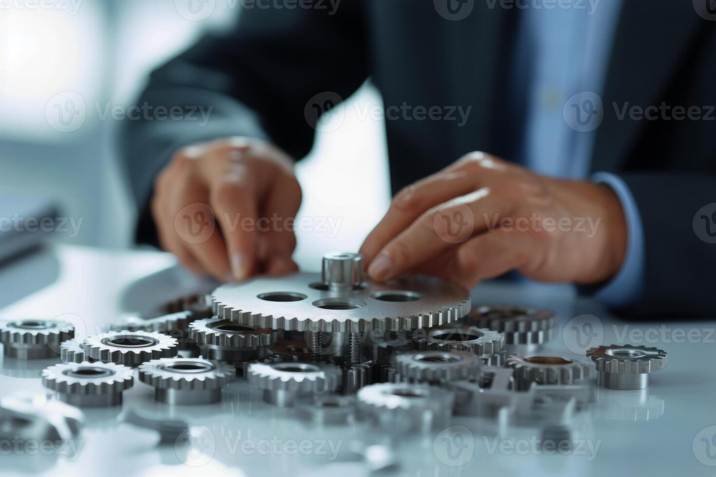 Man holding gear in hands. Teamwork metallic silver equipment industrial progress engineering machine mechanical cog wheel technology steel power transmission motion circle construction photo