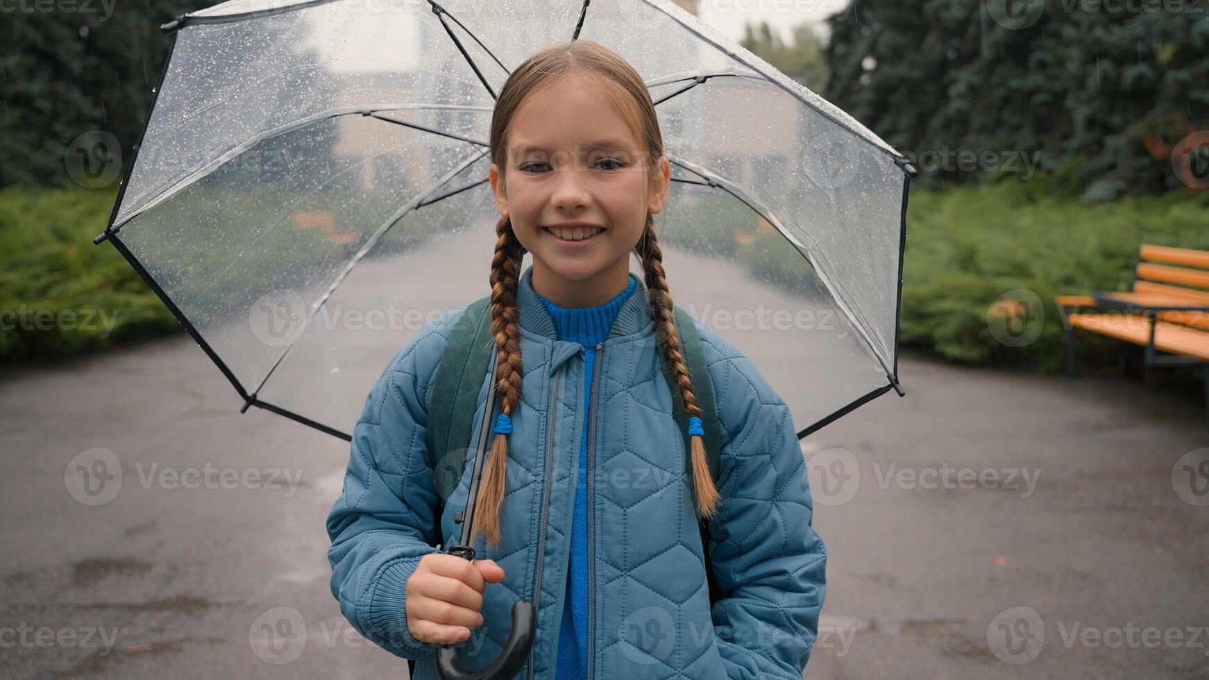 Close up girl standing city street outside umbrella rainy weather freshness dampness dropping meteorology climate springtime enjoyment happiness air relax child smiling resting wet waterfall joyful photo