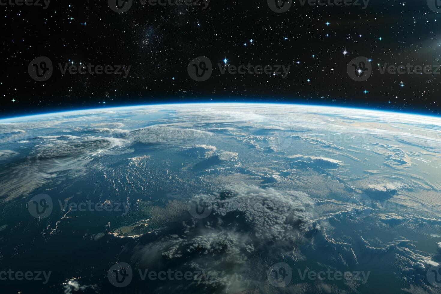 A view of the Earth from space, with a bright blue planet surrounded by a dark sky. The stars are scattered throughout the sky, creating a sense of vastness and wonder photo